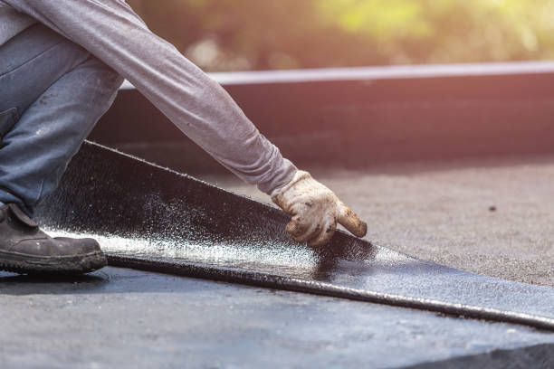 Professional Basement Waterproofing technician working in Woodlake, VA